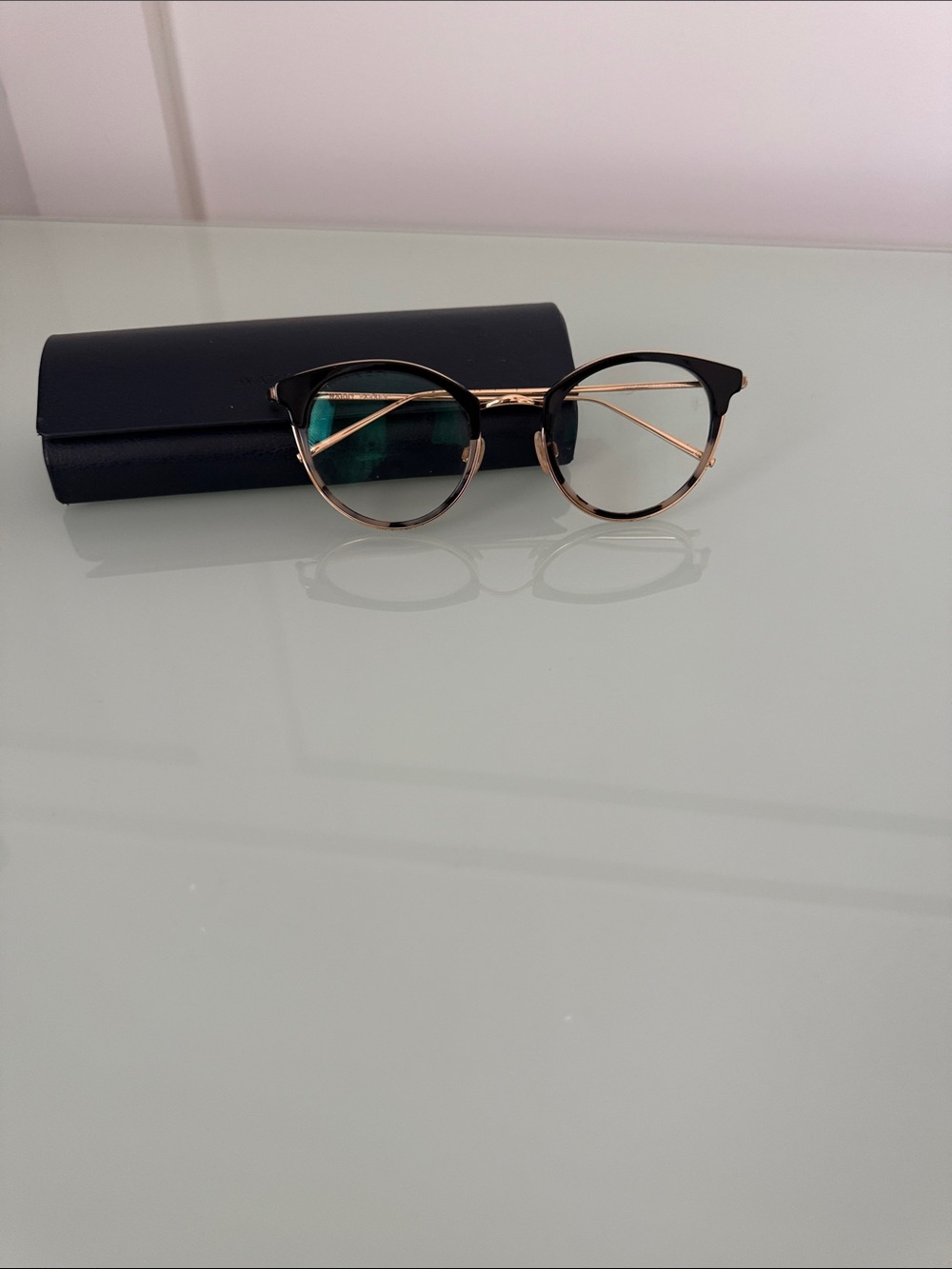 Warby Parker Round Black and Gold Eyeglasses with tortoise trim